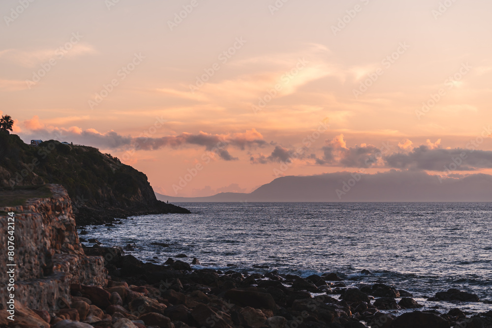 Sunset view from Gordons bay with cape point across the by a