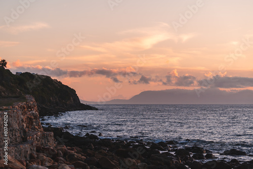 Sunset view from Gordons bay with cape point across the by a