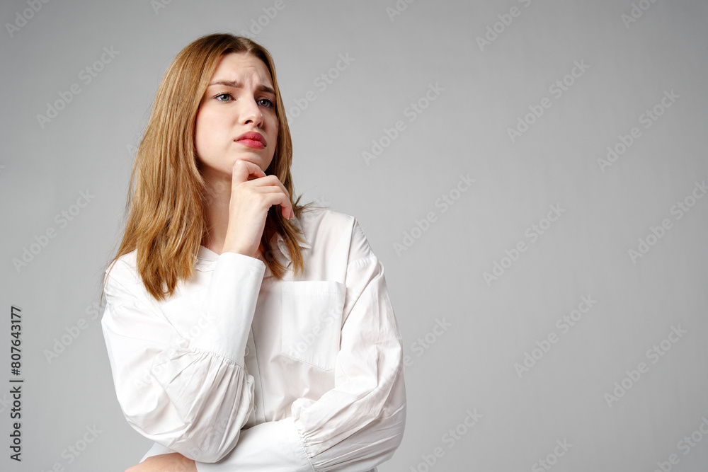 Concerned Young Woman deep in thought or contemplation Concerned Young Woman deep in thought or contemplation