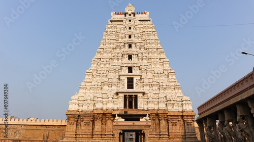 Beautiful White Vellai Gopuram of Sri Ranganatha Swamy Temple, World Largest Hindu Temple, Srirangam, Tiruchirappalli, Tamil Nadu, India.  photo