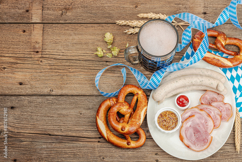 Traditional Oktoberfest set. Pretzels, beer, weisswurst, eisbein with mustard. German festival food