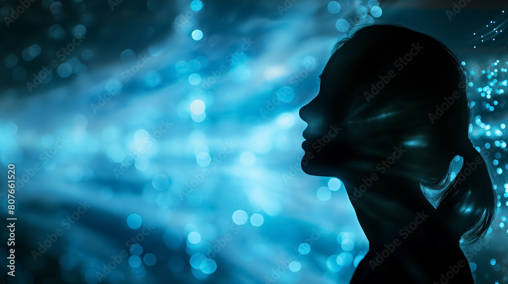 Woman's silhouette, her profile outlined against a mesmerizing background of sparkling blue lights, creating a dreamlike and ethereal atmosphere. Woman's silhouette, her profile outlined against a mesmerizing background of sparkling blue lights, creating a dreamlike and ethereal atmosphere.