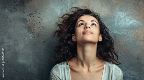 Woman looking up with admiration photo