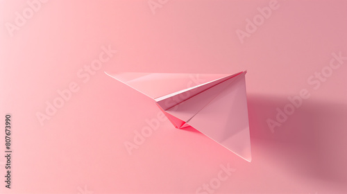 Minimalist Pink Paper Airplane on Subtle Pink Background