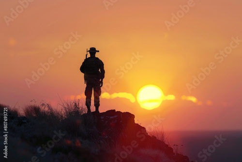 A man standing on top of a mountain at sunset. Suitable for travel and adventure concepts