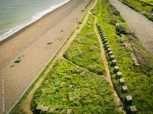 Aerial view of recently installed concrete block sea defences seen on the Suffolk, UK coastline. The area is prone to flooding and coastal erosion. photo