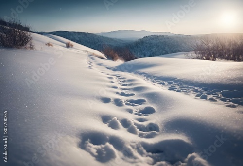 Footprints in snow with a mountain backdrop, AI-generated.