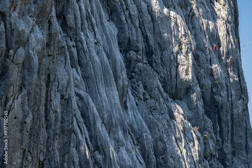 Silhouette of a climber on a steep rock. Mount Anica Kuk, Paklenica National Park, Croatia. photo