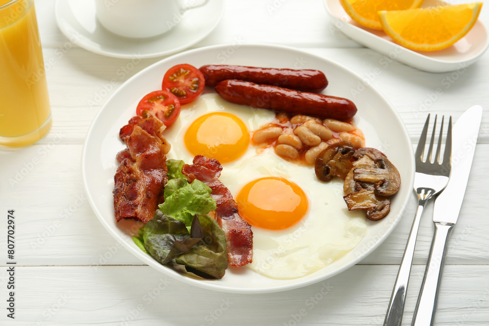 Delicious breakfast with sunny side up eggs served on white wooden table, closeup Delicious breakfast with sunny side up eggs served on white wooden table, closeup