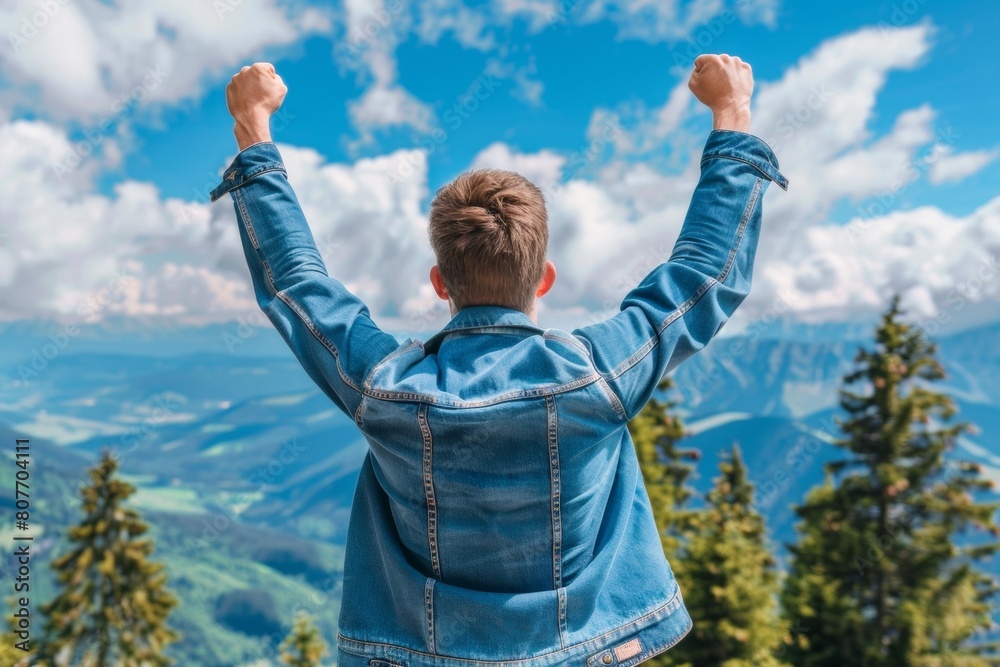 Man Celebrating on Mountain Top with Arms Raised, Victory, Freedom, Outdoor Adventure Man Celebrating on Mountain Top with Arms Raised, Victory, Freedom, Outdoor Adventure