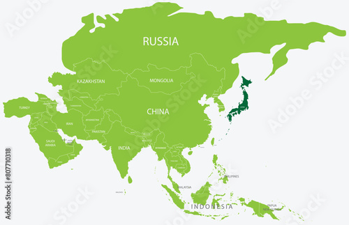 Highlighted green map of JAPAN inside light green political map of Asia using orthographic projection on light blue background
