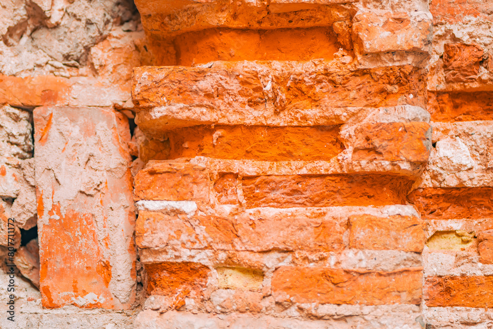 Close-up view of a weathered brick wall texture Close-up view of a weathered brick wall texture