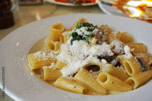 Close up Rigatoni Pasta in Carbonara and truffle sauce with cheese and bacon