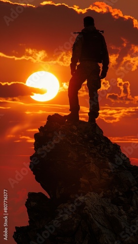 Courage in the face of adversity: His silhouette cuts a striking figure against the backdrop of a setting sun.