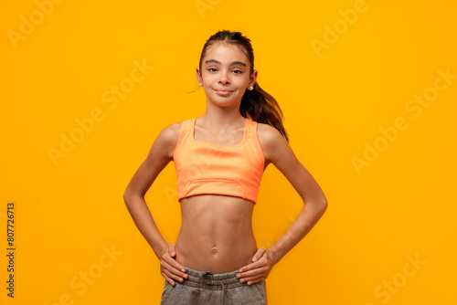 Smiling kid girl in sports clothing