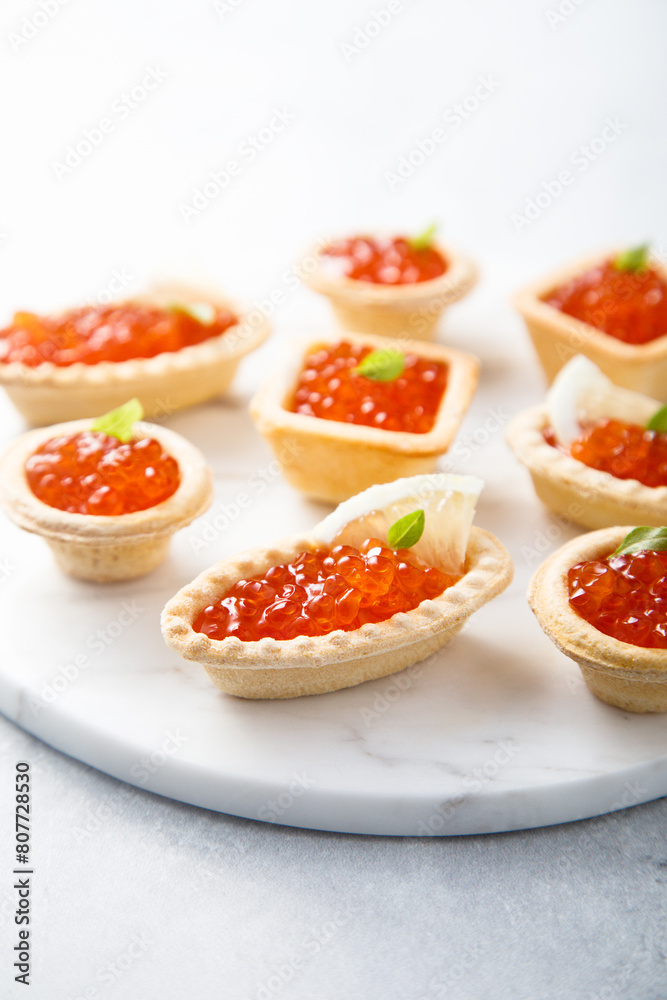 Red caviar served in tartlets Red caviar served in tartlets