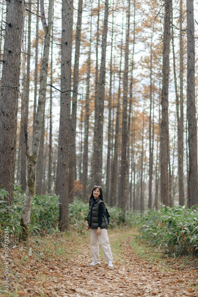 Journey into the heart of Japan with asian traveler, as this young Asian woman explores a scenic trail during a fall vacation. Journey into the heart of Japan with asian traveler, as this young Asian woman explores a scenic trail during a fall vacation.