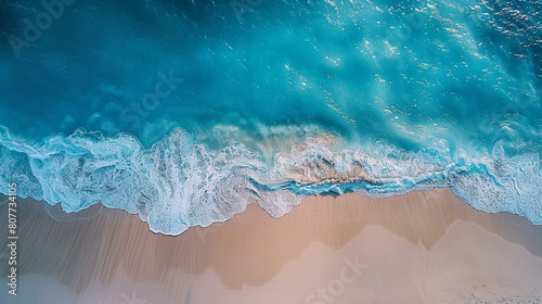 Beach Sand Sea Shore with Blue wave and white foamy summer background,Aerial beach top view overhead seaside. © BoszyArtis