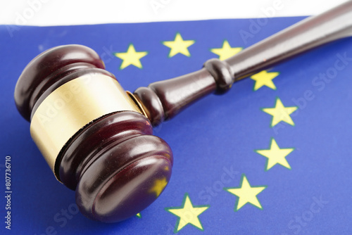 EU law, Legal, justice and agreement, wooden court gavel on flag.