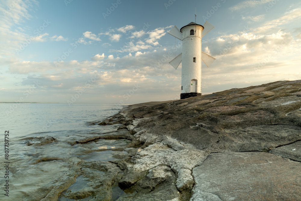 Panoramic image of an old lighthouse in Swinoujscie, a port in Poland on the Baltic Sea.