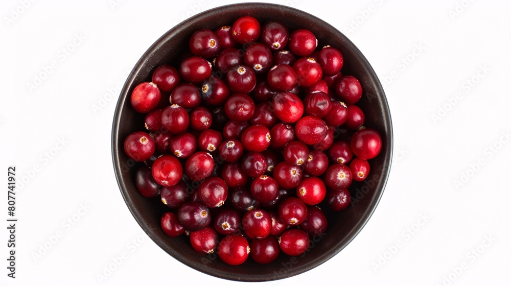 A bowl of fresh, mature cranberries seen from above, separated from the background. A bowl of fresh, mature cranberries seen from above, separated from the background.