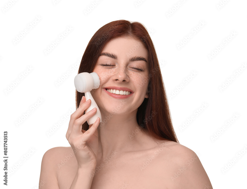 Washing face. Young woman with cleansing brush on white background Washing face. Young woman with cleansing brush on white background