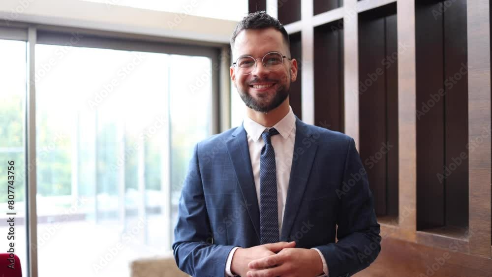 Video portrait of a happy, young businessman enjoying at his company Video portrait of a happy, young businessman enjoying at his company