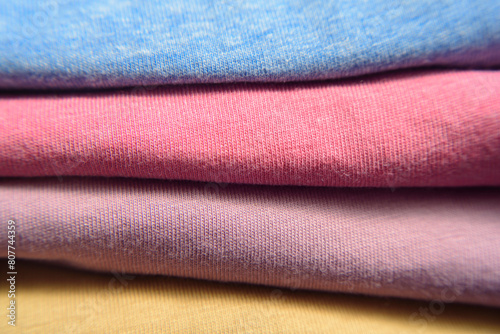 Camisetas de algodon de colores dobladas y apiladas photo