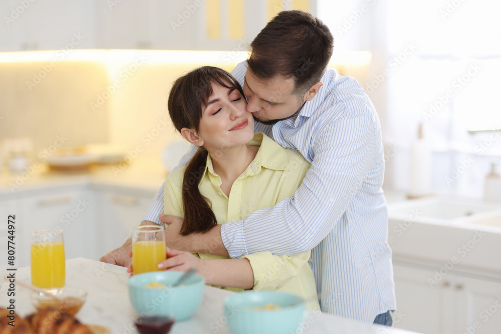 Lovely couple spending time together during breakfast at home Lovely couple spending time together during breakfast at home