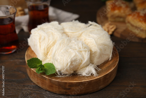 Eastern sweets. Tasty Iranian pashmak on wooden table, closeup photo