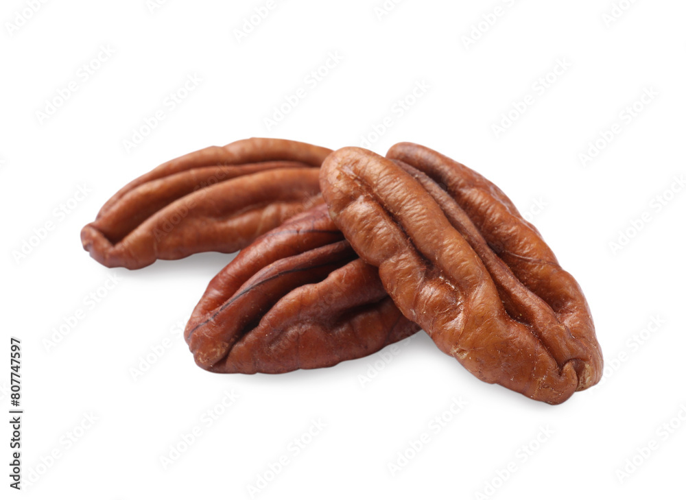 Three tasty pecan nuts isolated on white Three tasty pecan nuts isolated on white
