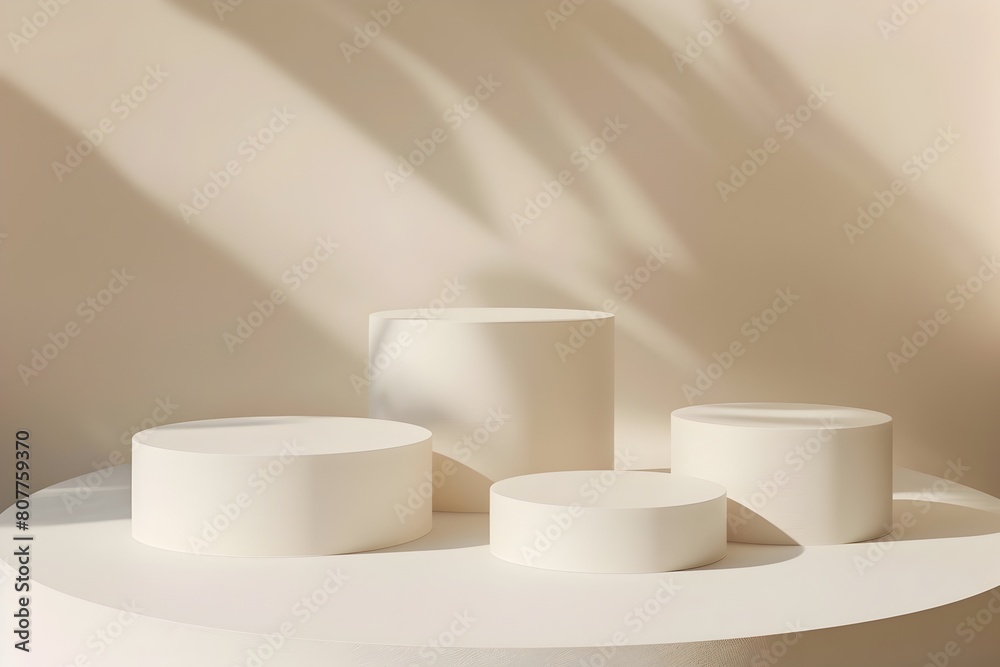 Three White Cylindrical Podiums of Varying Heights on Minimalist Background Three White Cylindrical Podiums of Varying Heights on Minimalist Background