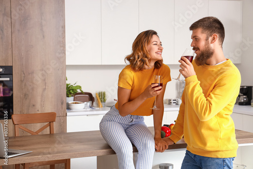 Happy couple in love drinki...