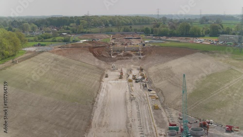 Aerial of a megaproject train track construction site, diggers , buldozers and other machinery - Railway track HS2  photo