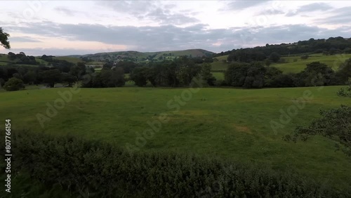 Machynlleth sheep farm in Wales with drone video moving up and forward. photo