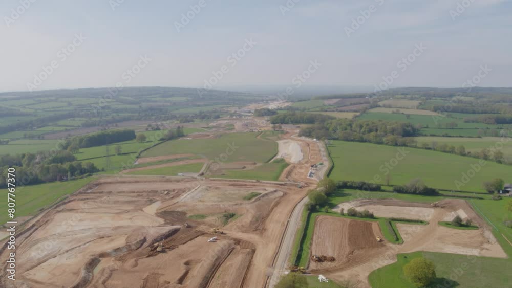 Vast aerial vista of construction of HS2 megaproject scarring of the green countryside