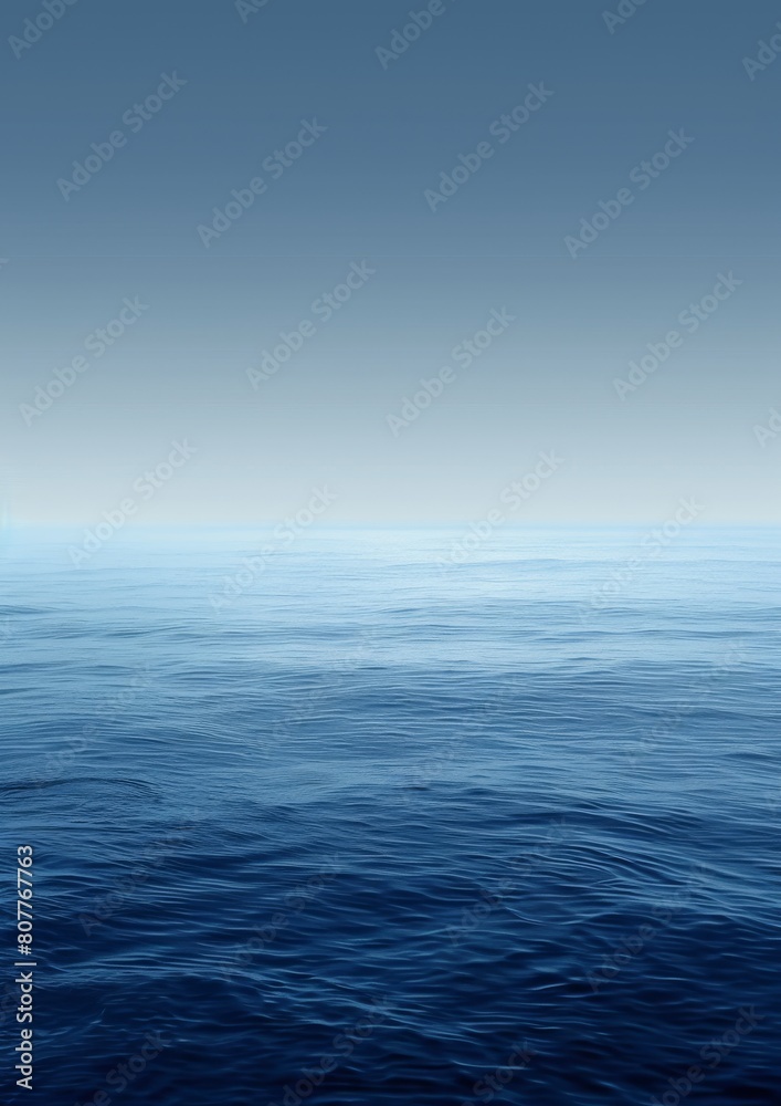 A calm blue ocean with a clear sky above