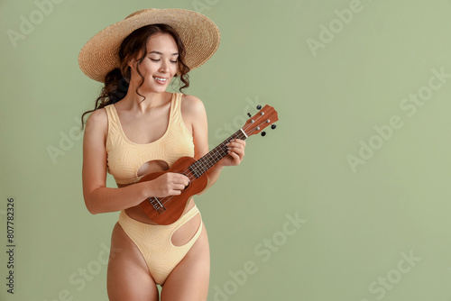 Smiling young woman in stra...