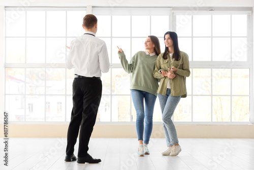 Real estate agent discussin...
