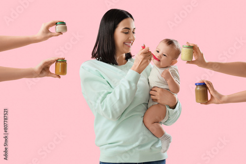 Young woman feeding her lit...
