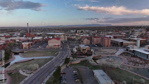 Early morning 4k aerial footage of downtown Pueblo, Colorado over I25 with mountains in the distance.