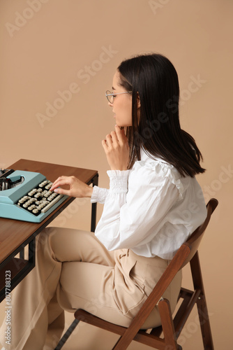 Beautiful young woman worki...