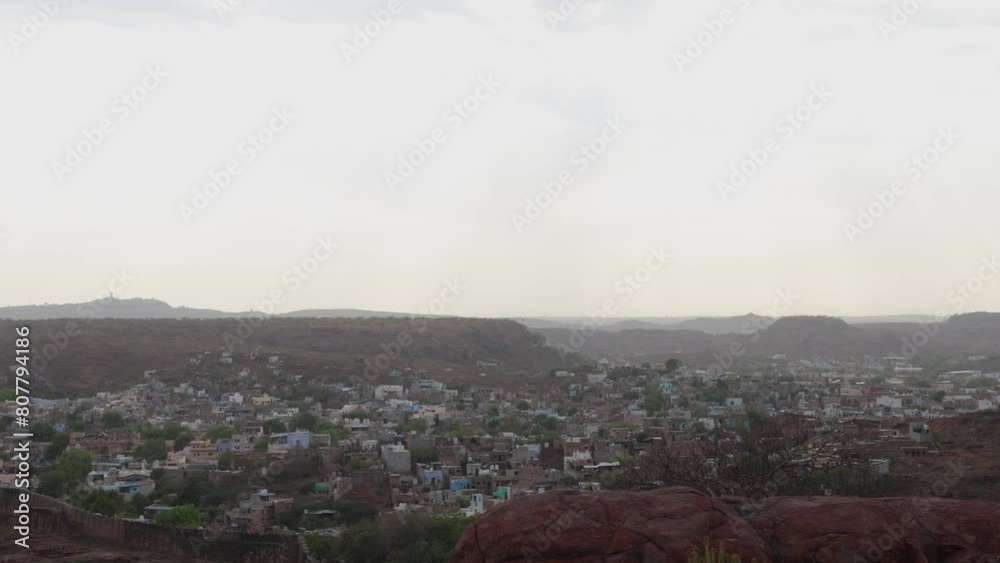 blue city view with dramatic sunset sky at evening from flat angle video is taken at mehrangarh fort jodhpur rajasthan india. blue city view with dramatic sunset sky at evening from flat angle video is taken at mehrangarh fort jodhpur rajasthan india.
