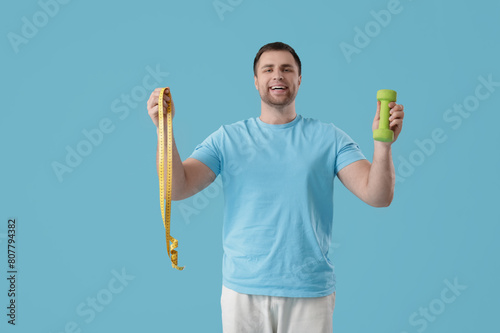 Young man with tape measure...
