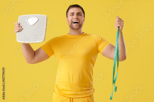 Young man with scales and t...