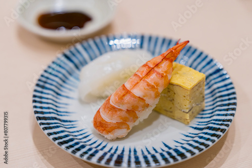 Japanese sushi set. Shrimp and Salmon sushi on dise.