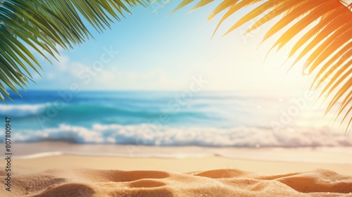 beautiful summer background with palm leaves and a sandy beach © Raffaza