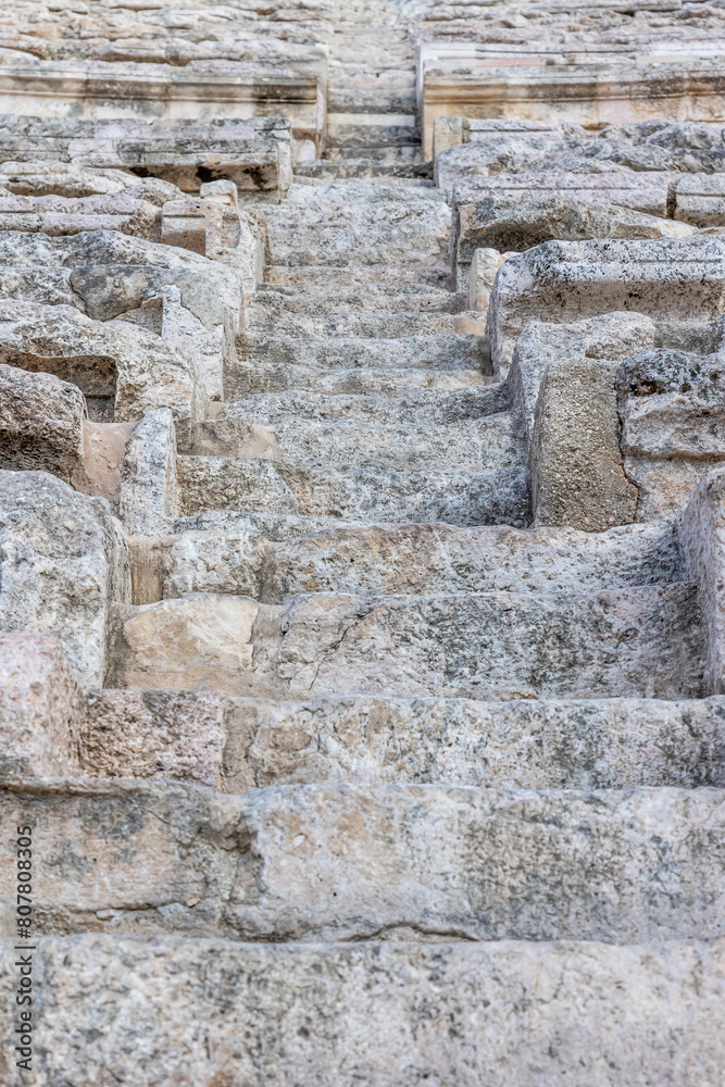 Detail of the stone steps in the ancient theater. Amman. Jordan. Vertically. Detail of the stone steps in the ancient theater. Amman. Jordan. Vertically.