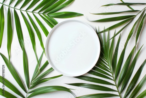 White plate with a palm leaf on it