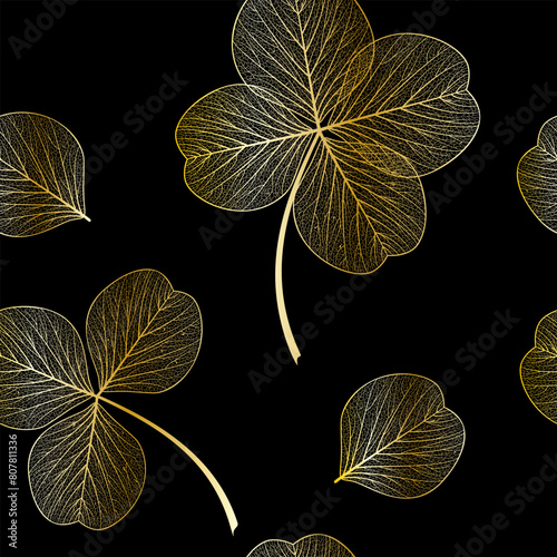 Seamless pattern with gold clover leaves. Vector illustration.